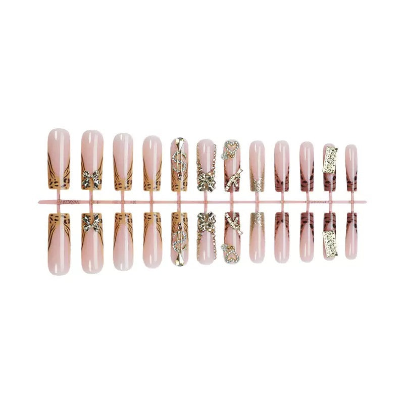 Best-Selling Long Tube Press-On Nails with Elaborate Bow, Gold Rhinestone Accents, and Leopard Print — Long Press-On Nail Set