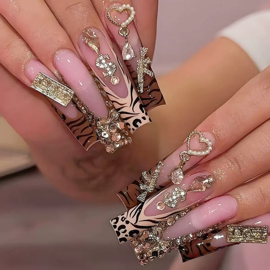 Elaborate Alloy Bow Press-On Nails with Gold Rhinestones, Leopard Print, and Long Tube Shape