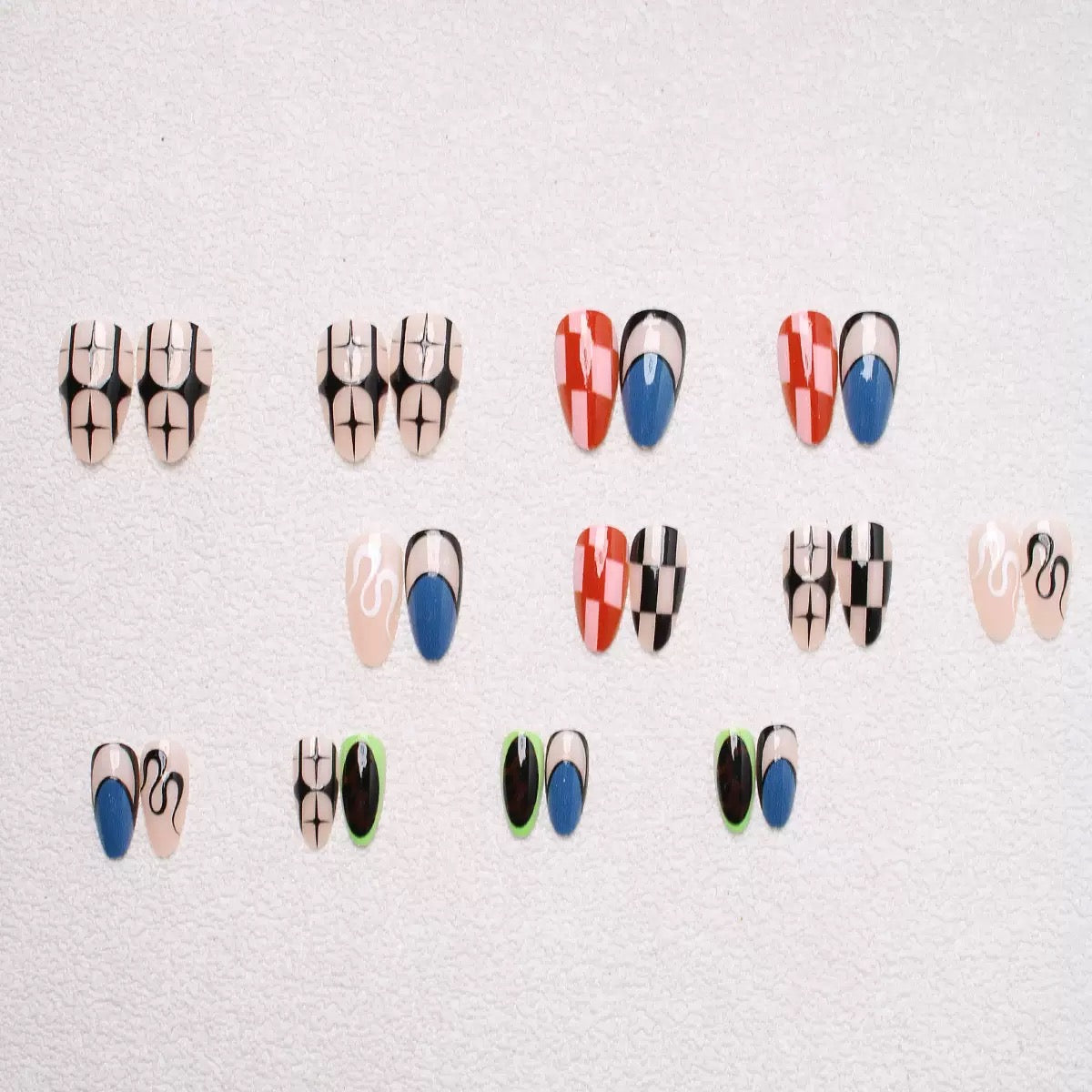 Pure & Elegant Mismatched Black-and-White Wavy Striped Almond Press-On Nails — Sexy It-Girl Style