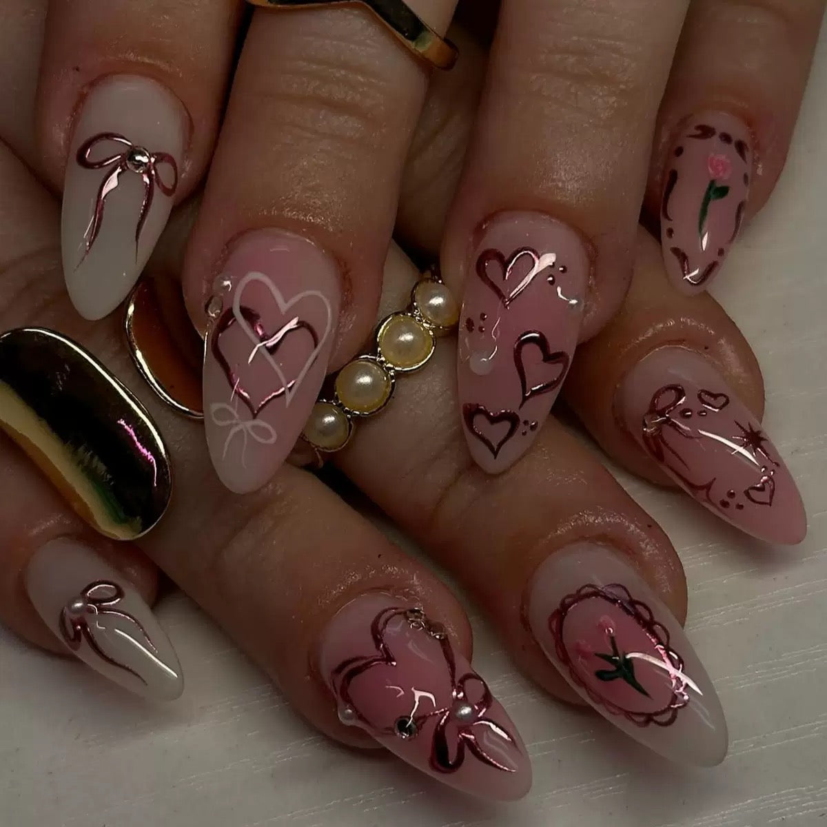 Sweet-cool style — sweet heart and bow almond-short press-on nails