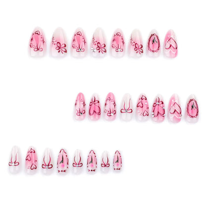 Sweet-cool style — sweet heart and bow almond-short press-on nails