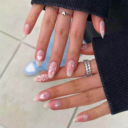 Valentine’s Day Simple Almond Press-On Nails with Heart, Bow, and Rhinestone Accents